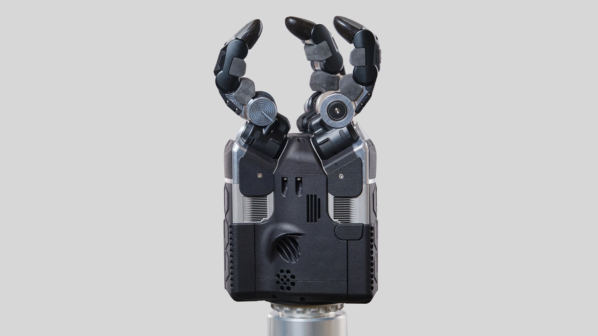 A close-up of a robotic hand featuring three fingers prominently positioned on top, showcasing advanced technology.